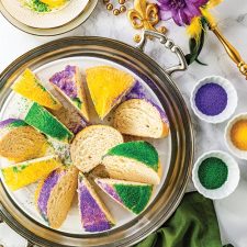 Sliced mardi gras king cake